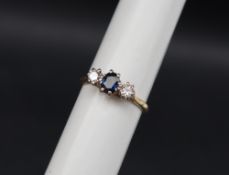 A sapphire and diamond three stone ring,