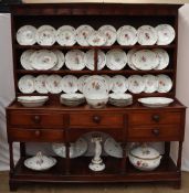 A 19th century Copenhagen porcelain part dinner set painted with garden flowers to a basket weave