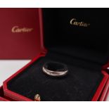 A Cartier 18ct white gold wedding band decorated with the Cartier trade mark, size Q,