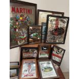 A collection of advertising mirrors, including Martini, Southern Comfort, Rolls Royce,