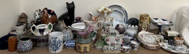 A Bretby pottery cat together with pottery jugs, part tea sets, Staffordshire sheep group,