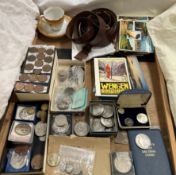 A collection of coins including pennies, crowns, 1901 Morgan Dollar, postcards, Sam Brown belt,