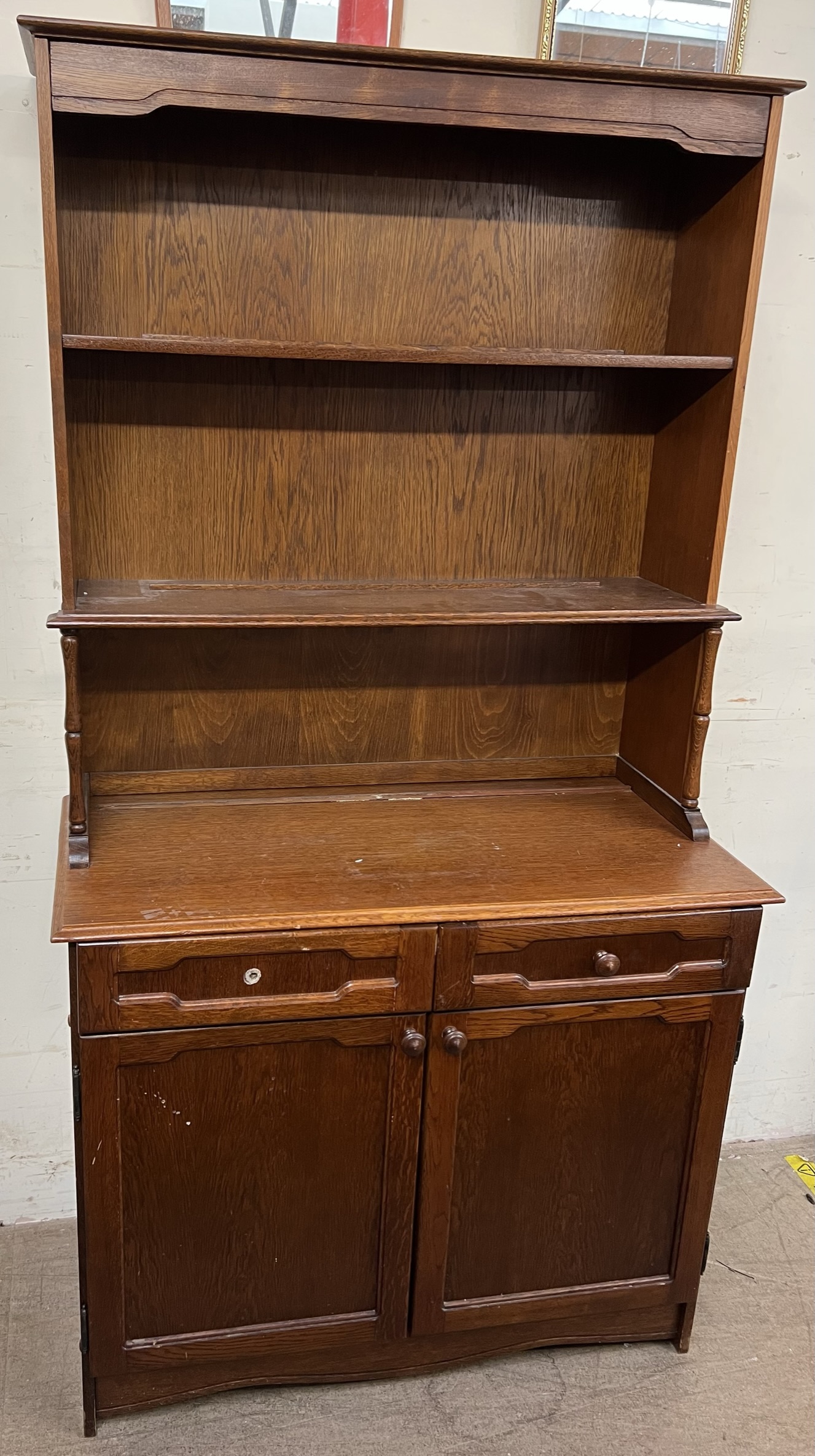 A 20th century oak dresser, with a planked back and two shelves,