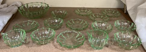 A uranium glass dessert set comprising a large bowl, six bowls and saucers,