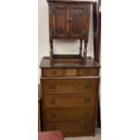 A 20th century oak chest of drawers together with a 20th century oak linen fold side cabinet