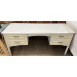 A modern dressing table with four drawers on octagonal legs