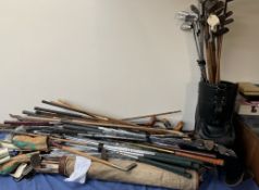 A large quantity of vintage and more modern golf clubs and golf bags etc including a jade putter,