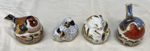 Four Royal Crown Derby paperweights including a robin nesting, lambs,