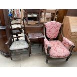 An Edwardian walnut framed library chair,