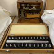 An Ime watch makers lathe, cased, together with a wedding ring gauge set,