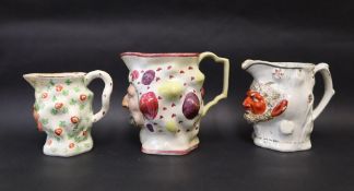 Three assorted 19th century Staffordshire Bacchus / satyr faced jugs,