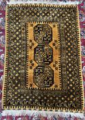 A Turkish rug with a yellow ground the centre with three geometric medallions with various guard