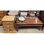 A modern low coffee table with a planked top on turned legs together with a pine bedside chest,