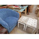 An upholstered tub chair in blue together with a pair of upholstered dressing table stools