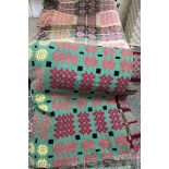 A Welsh blanket with a green ground and geometric patterns together with another Welsh blanket