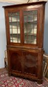 A 19th century mahogany standing corner cupboard