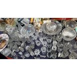 A large quantity of cut glass including bowls, drinking glasses,