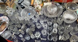 A large quantity of cut glass including bowls, drinking glasses,