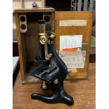 A "Kima" W. Watson & Sons Ltd microscope, cased with lenses