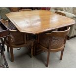 A 20th century oak pedestal dining table of square form,