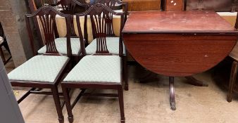 A reproduction mahogany drop leaf dining table together with a set of four George III style