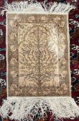 A Persian silk rug / wall hanging with a yellow ground and tree and birds to the centre,