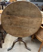 A 19th century oak tripod table,