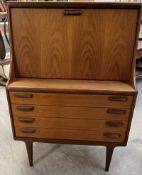 A mid 20th century teak bureau / drinks cabinet,