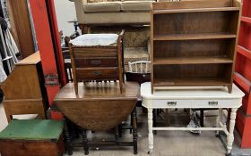 An oak gateleg dining table together with a small pine box, piano stool with music drawers,