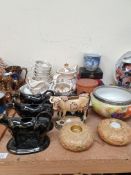 A Victorian pottery part tea set decorated with landscape scenes together with pottery cow creamers,