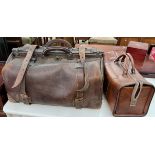 A large brown leather bag together with another bag