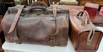 A large brown leather bag together with another bag