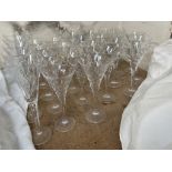 Waterford crystal champagne glasses together with a suite of glasses