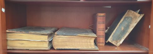 Two leather bound Welsh Bibles together with another bible and a photograph album