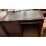 A reproduction mahogany desk, with a leather inset top,