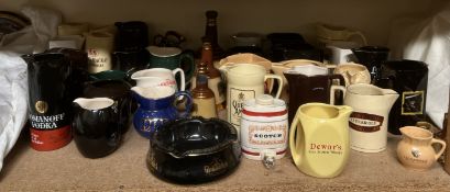 Assorted advertising water jugs including Dewar's, Long John, Queen Anne, Famous Grouse,