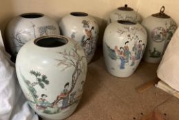 A set of six Chinese porcelain storage jars decorated with oriental figures