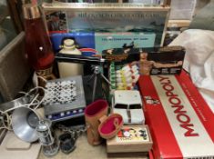 Assorted board games including Monopoly, Spy Ring, The Sir Francis Chichester Game, lava lamp,