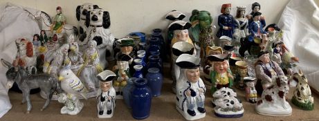 A collection of reproduction Staffordshire figures, together with other figure groups, Toby jugs,