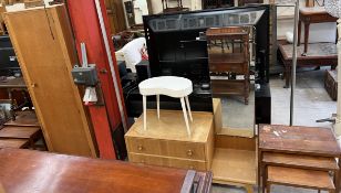 A 20th century oak wardrobe and matching dressing table together with a nest of three teak tables