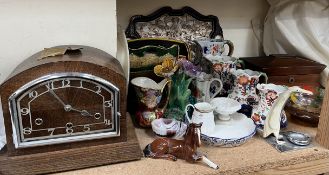 An oak mantle clock together with a mahogany sarcophagus box, graduated jugs, Crown Devon jug,