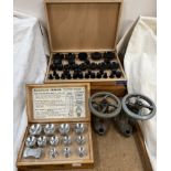 A cased set of Robur watch glass press attachments together with another set,