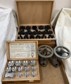 A cased set of Robur watch glass press attachments together with another set,