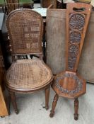 A walnut carved back stool, decorated with flowers and leaves,