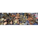 A large quantity of copper and brass including coal scuttles, fish kettles, measures,