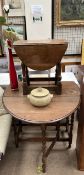 An oak gateleg dining table with an oval top on barley twist legs together with a small oak drop