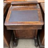 A Victorian walnut davenport,