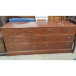 A G-Plan sideboard with seven drawers on a plinth,