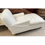 A modern upholstered day bed on tapering legs