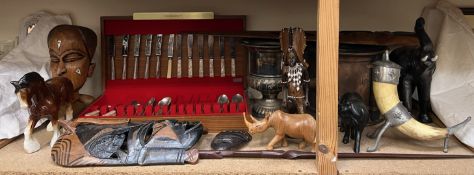 A Community plate part flatware service, cased together with African carvings,